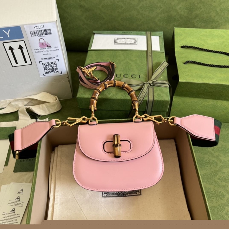 G*u*i top handle bags